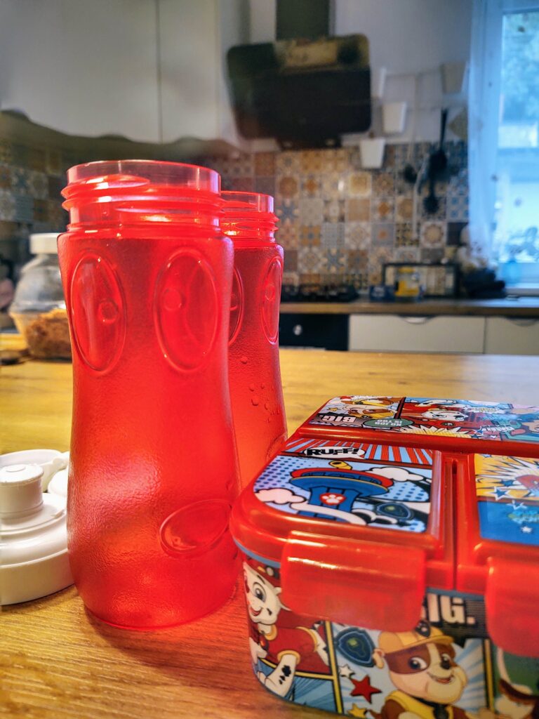 Packing for a weekend trip with kids: bottles and snack box